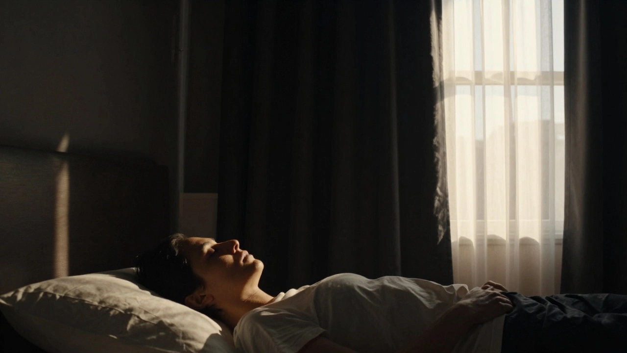 Morning sunlight streaming through sheer curtains while blackout curtains block all light in a bedroom.