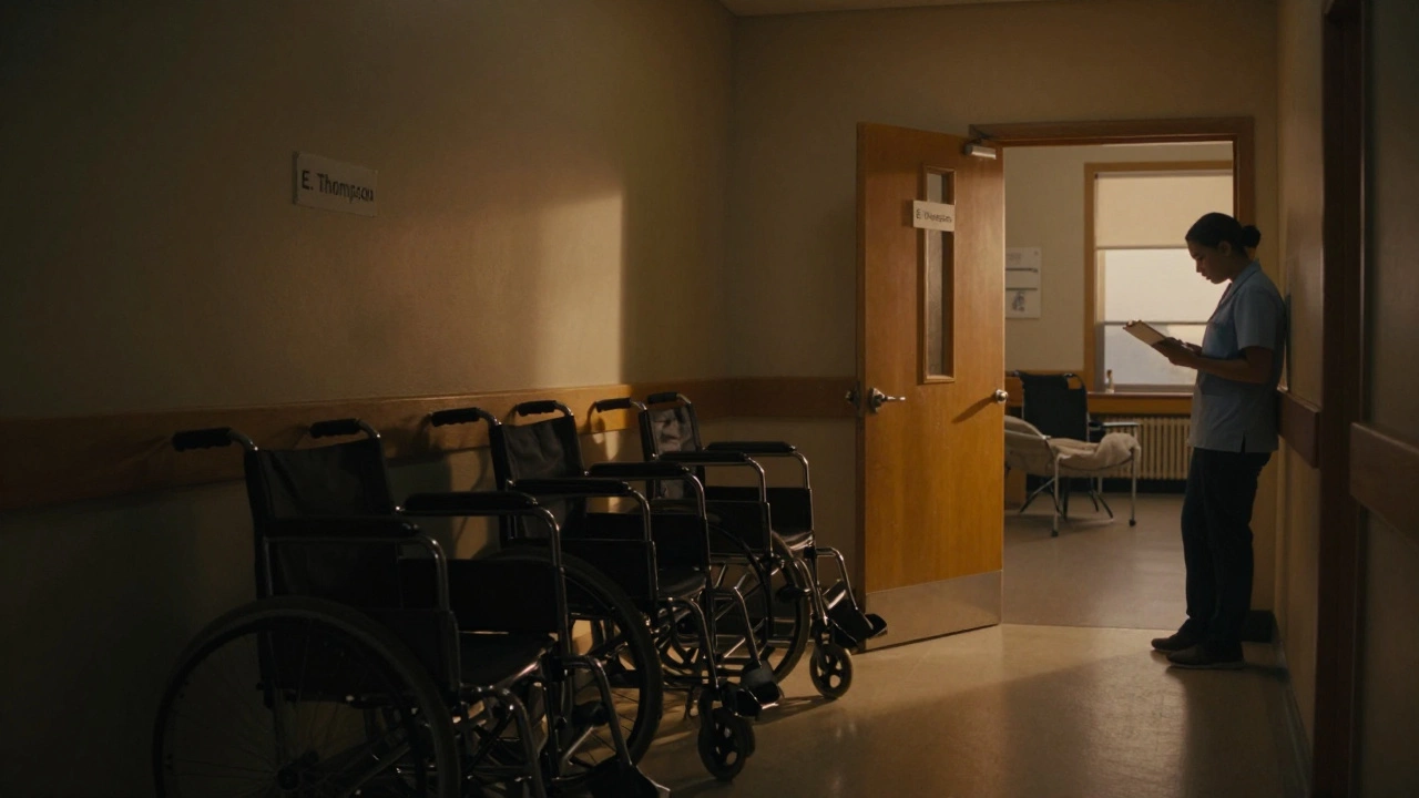A lonely hallway in a care home at dusk, empty wheelchairs and a door to a bare room.